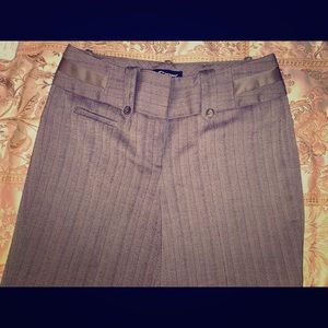 Tan and black crop dress pants.